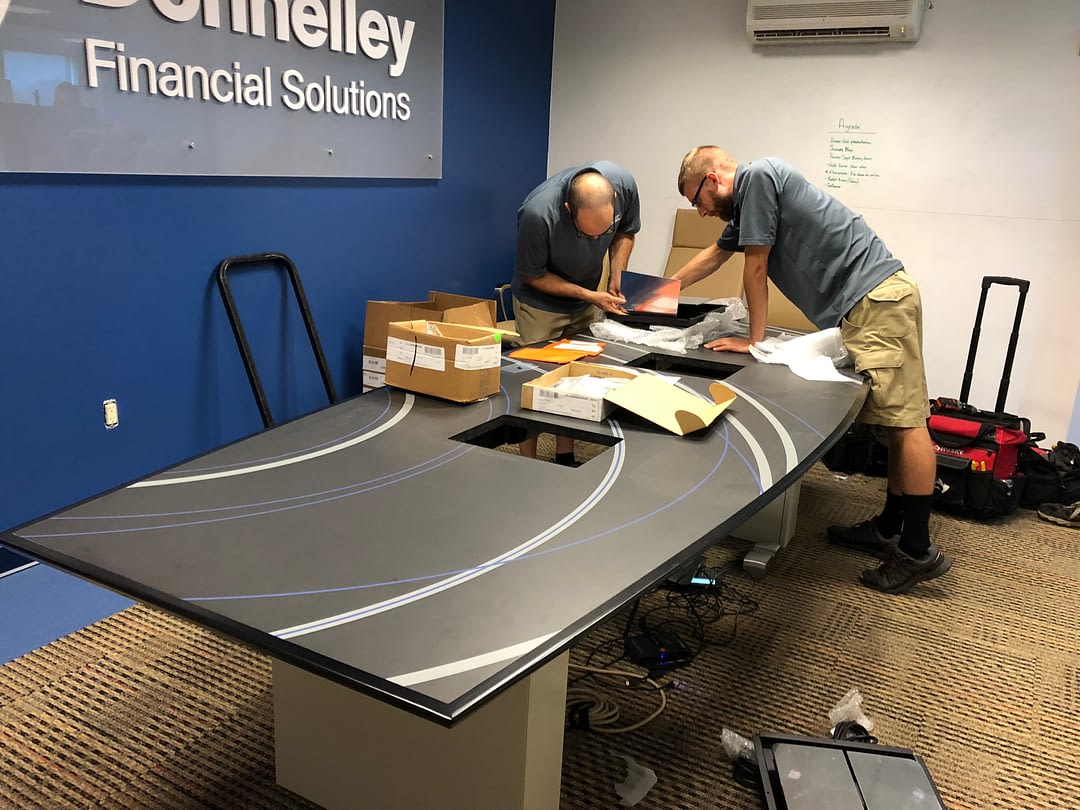 installers assembling a conference table