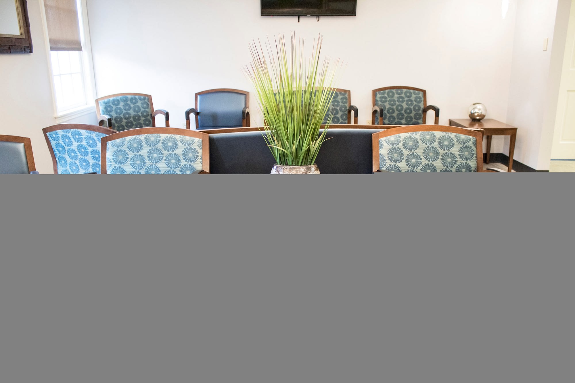 Two Chairs and Table in Waiting Room